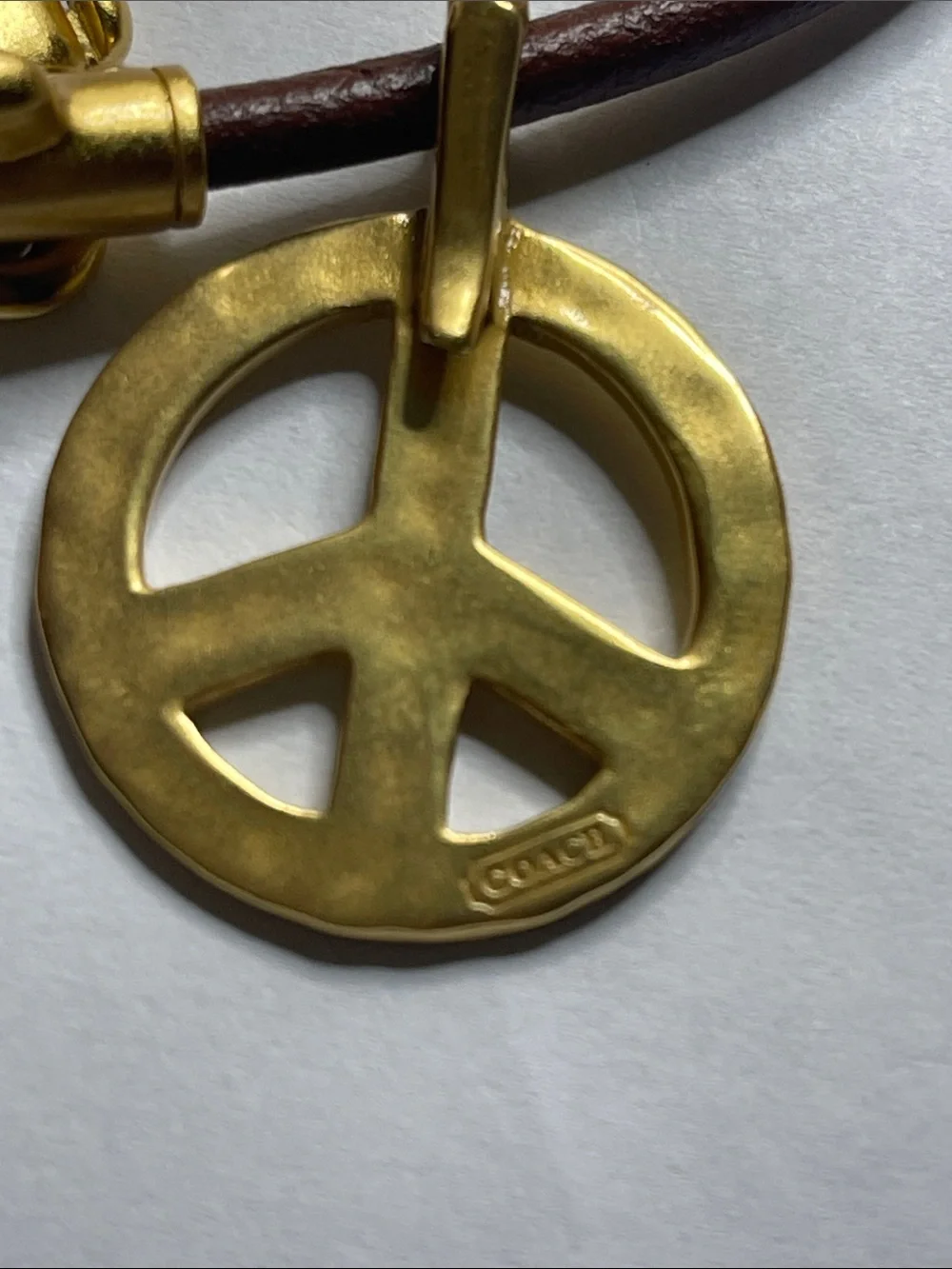 Coach Brown Leather Bracelet with Gold Peace Charm